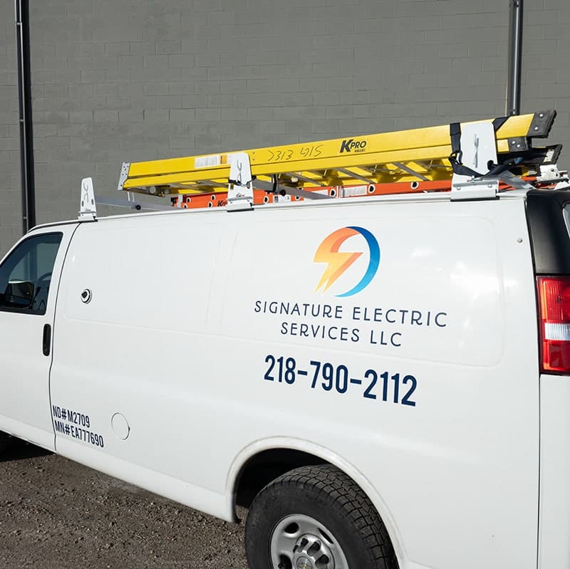 signature electric van by commercial building